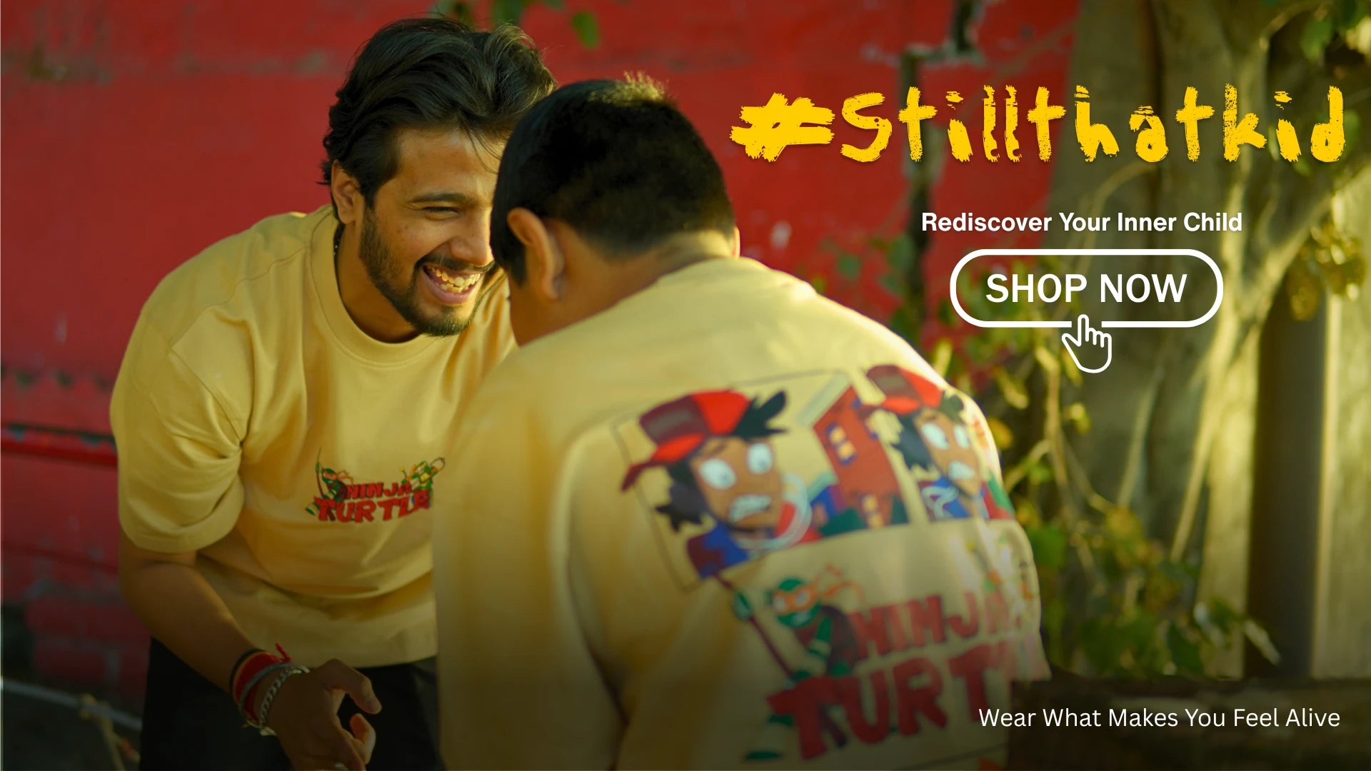 Two men wearing matching shirts with a visible brand logo, surrounded by a promotional graphic.