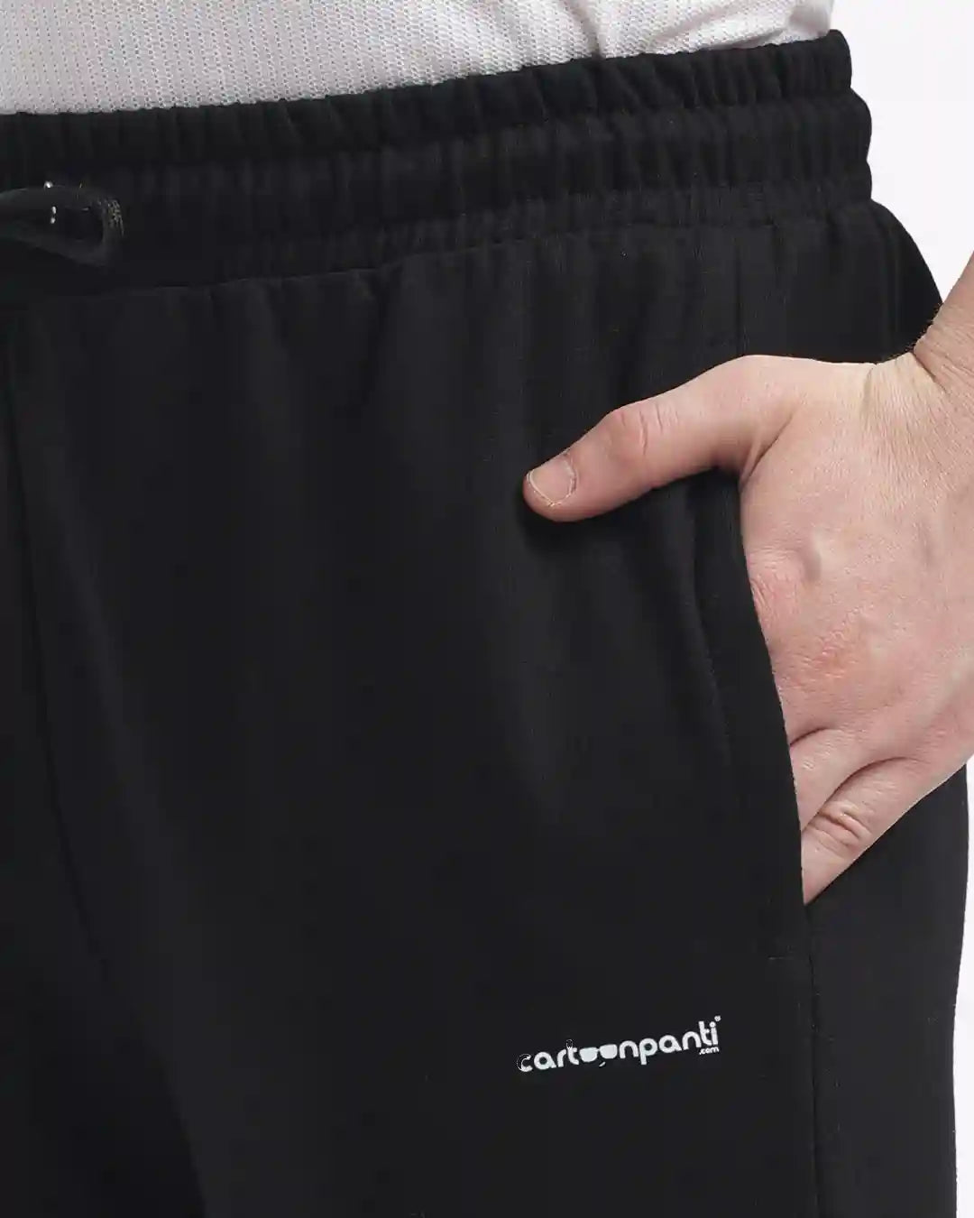 Black pants with a visible brand logo on a plain background