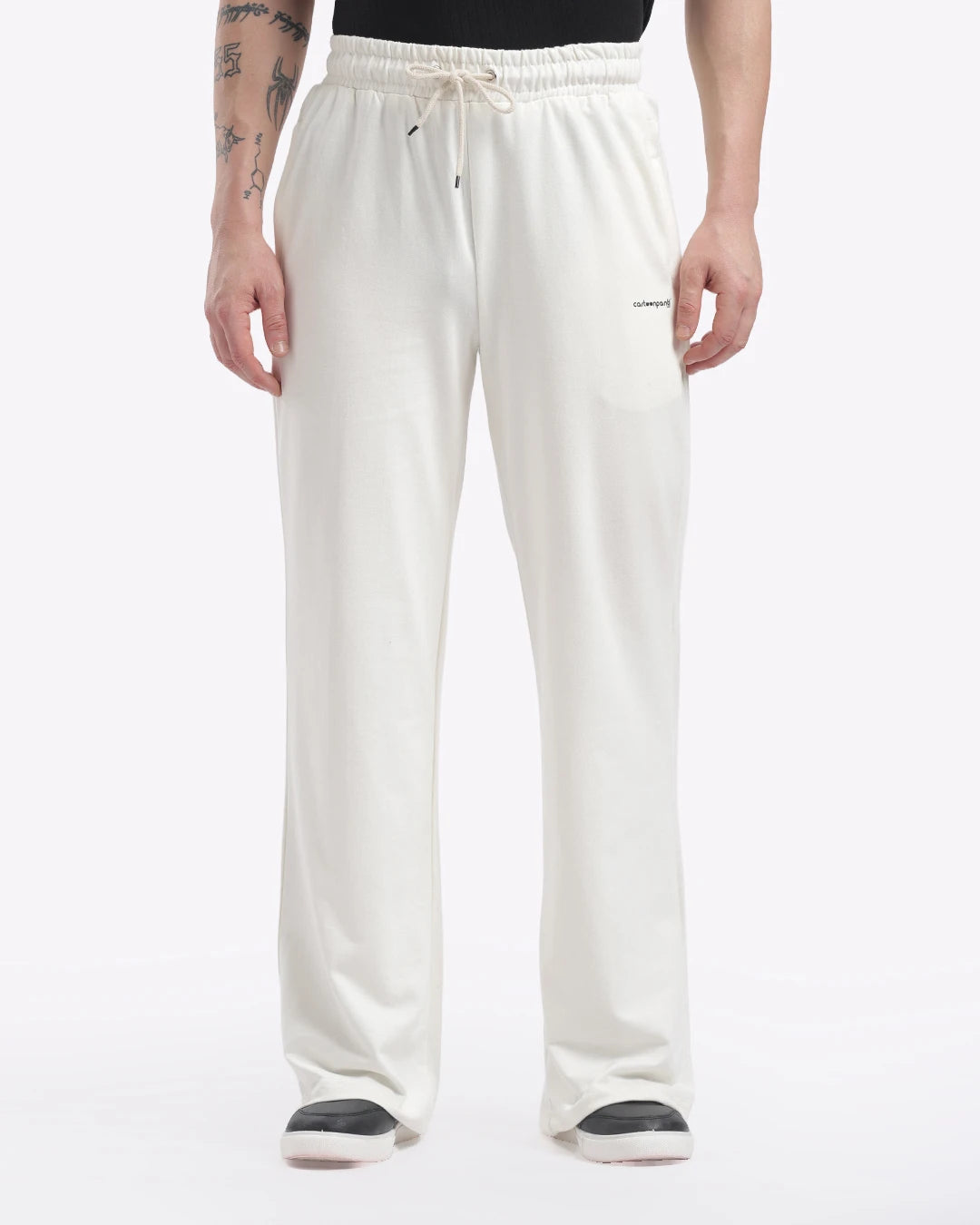 Person wearing white pants on a white background