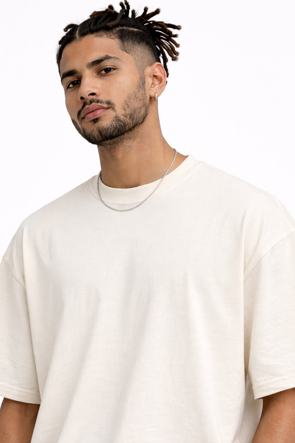 Person wearing a white t-shirt with black and red Hindi text on the back.