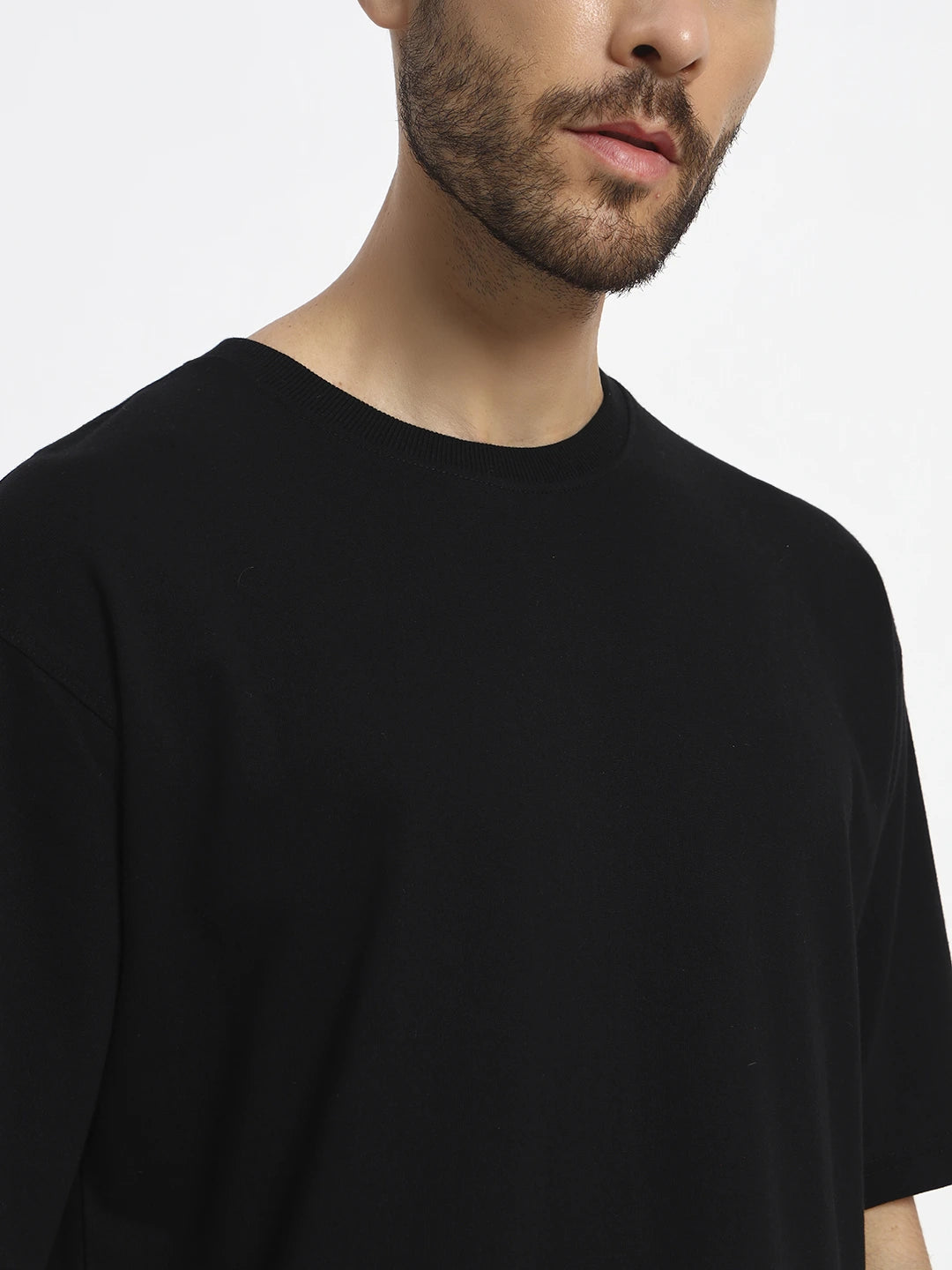 Man wearing a oversized black t-shirt  by cartoonpanti india