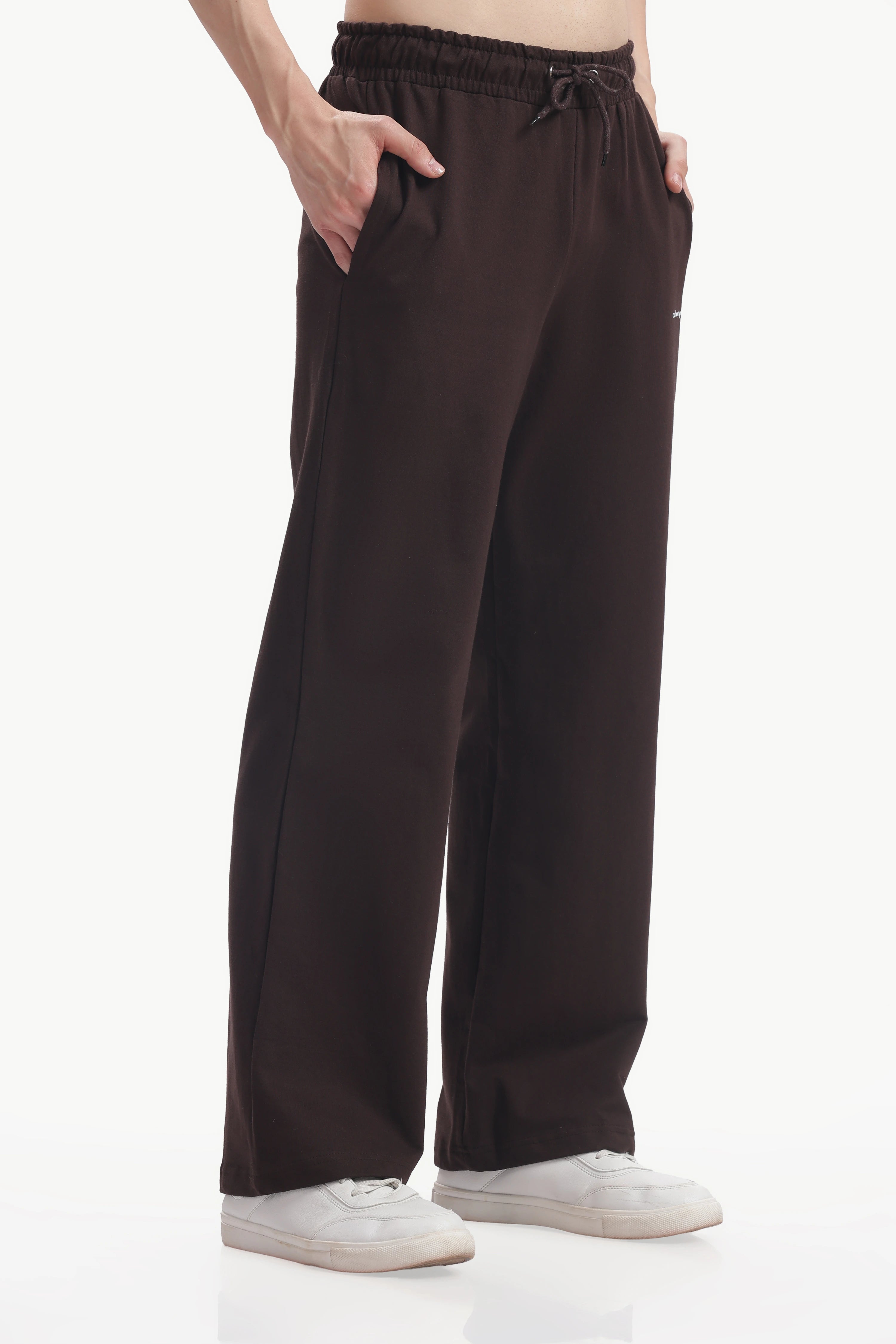 Brown pants worn by a person on a white background