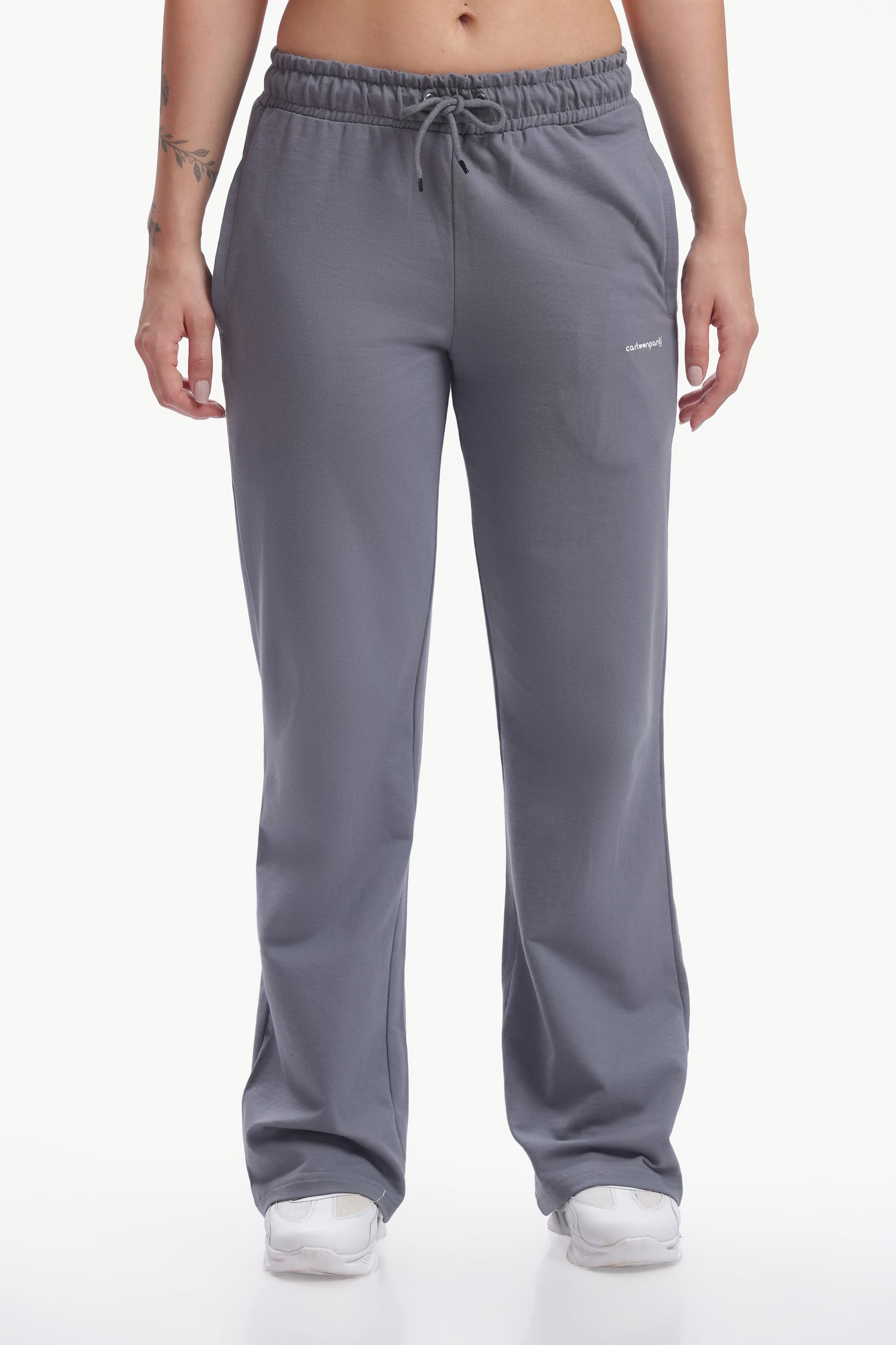 Gray sweatpants worn by a person on a white background