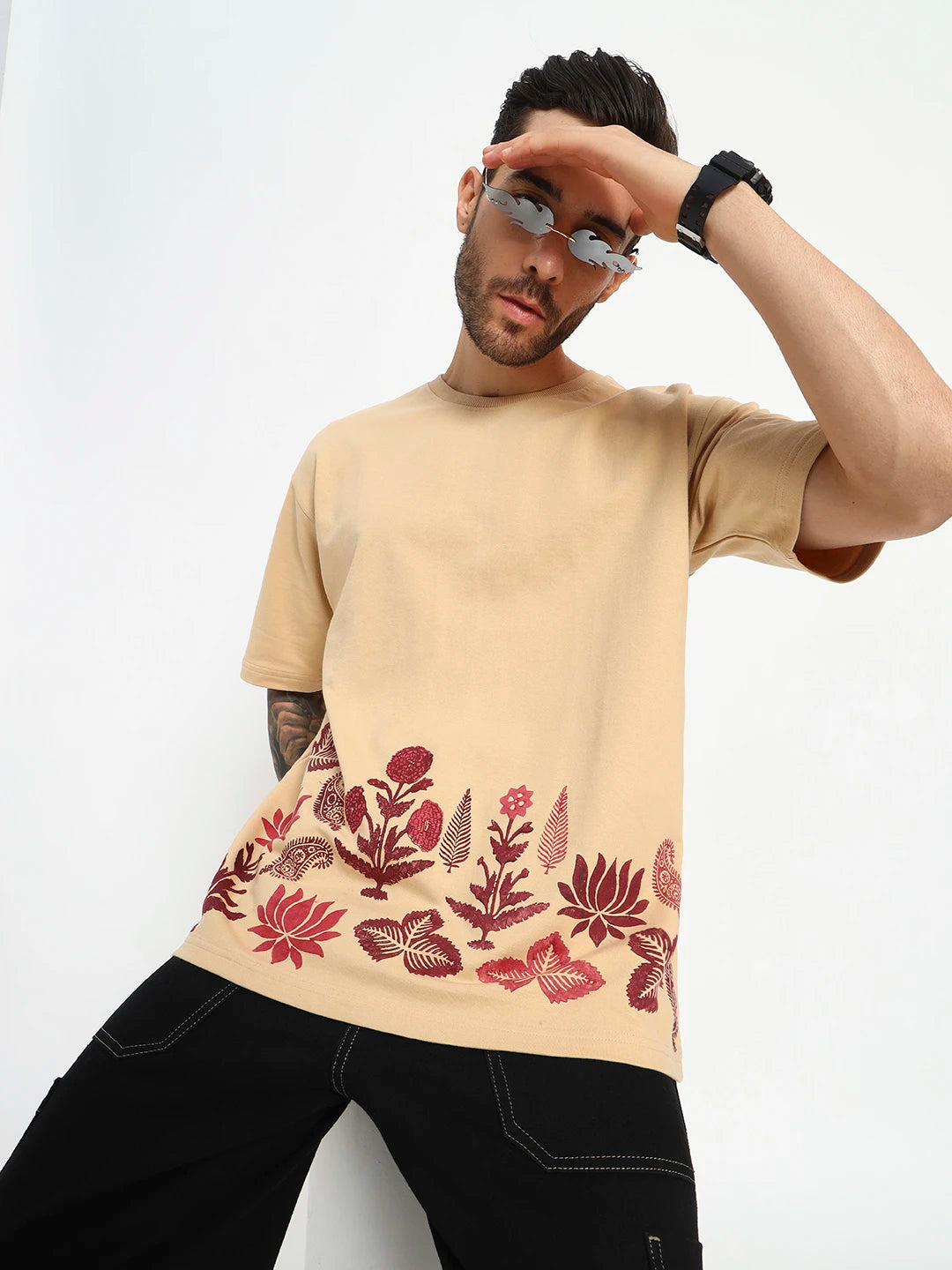 Man wearing a beige t-shirt with floral pattern  by cartoonpanti by india