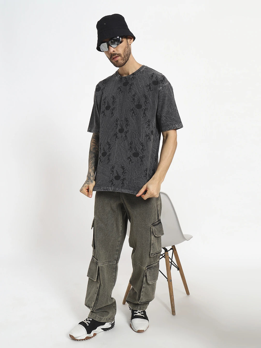 Man wearing a black distressed t-shirt oversized  by cartoonpanti india
