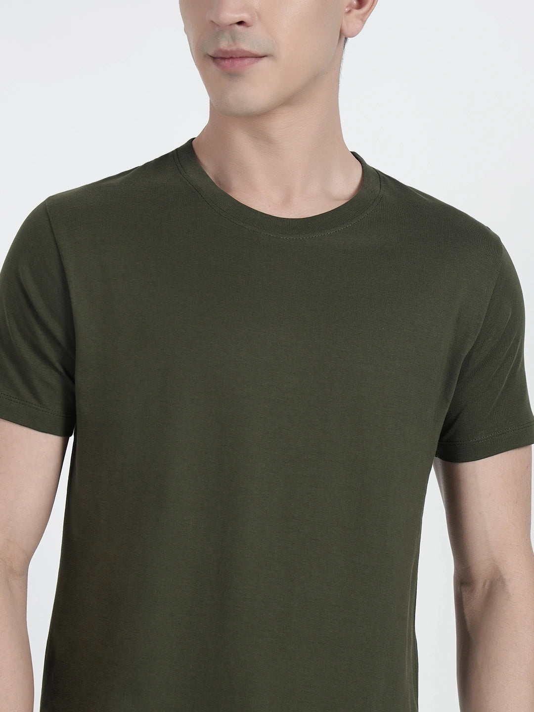 wearing an olive green plain T-shirt by cartoonpanti india