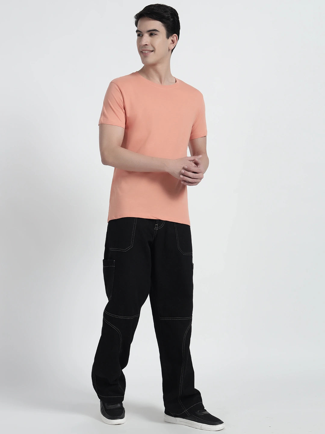 A man wearing an orange plain t-shirt t by cartoonpanti india.