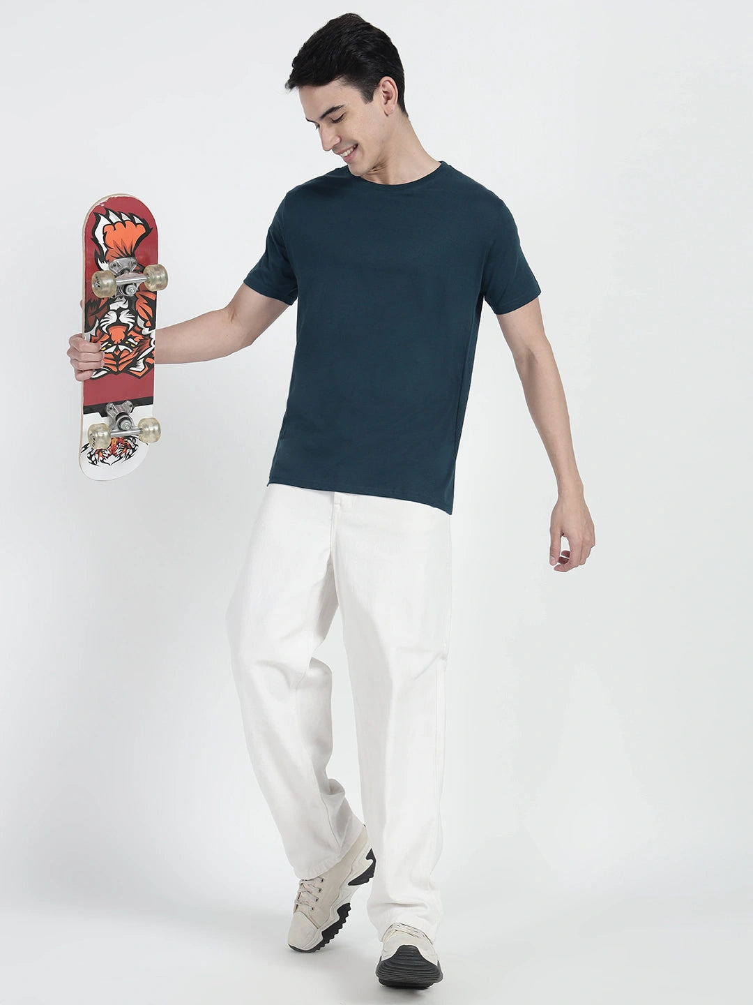 wearing a petrol blue plain T-shirt by cartoonpanti india