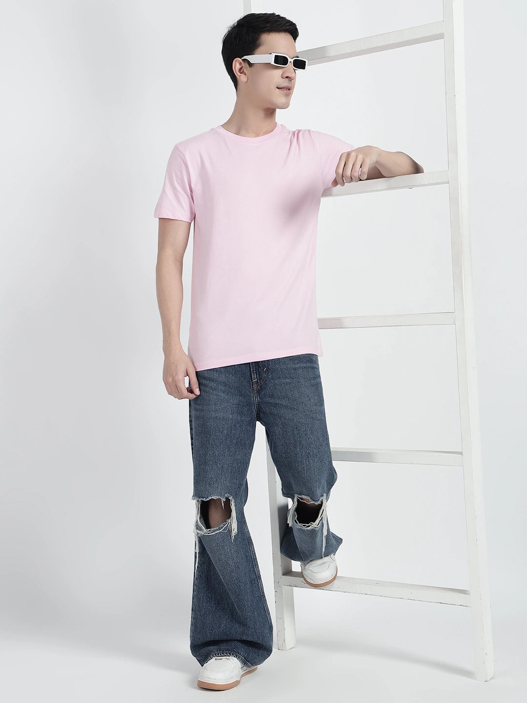 A person wearing a plain pink T-shirt by cartoonpanti india