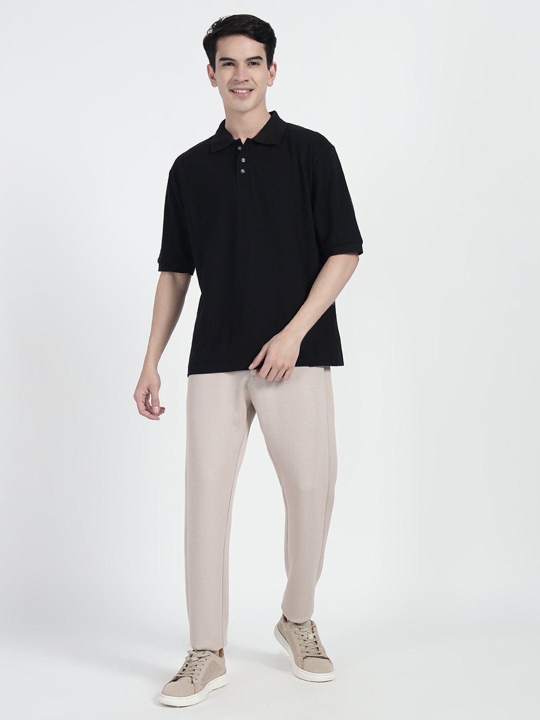  a black oversized polo shirt with a round neckline and long sleeves, paired  by cartoonpanti  india