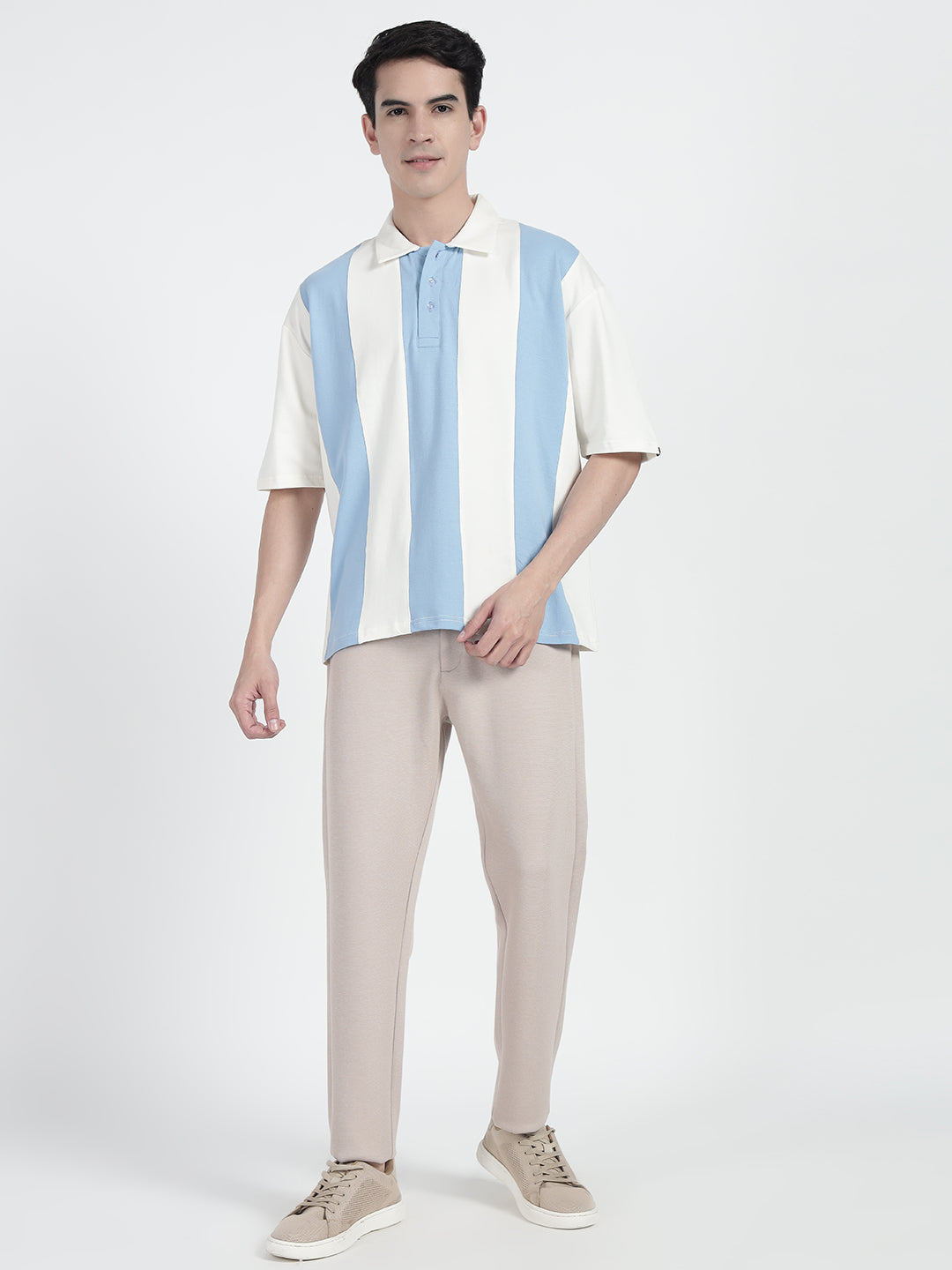 wearing a striped oversized polo shirt in white by cartoonpanti india