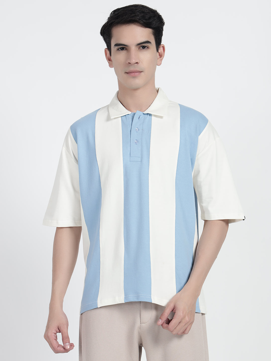 wearing a striped oversized polo shirt in white by cartoonpanti india