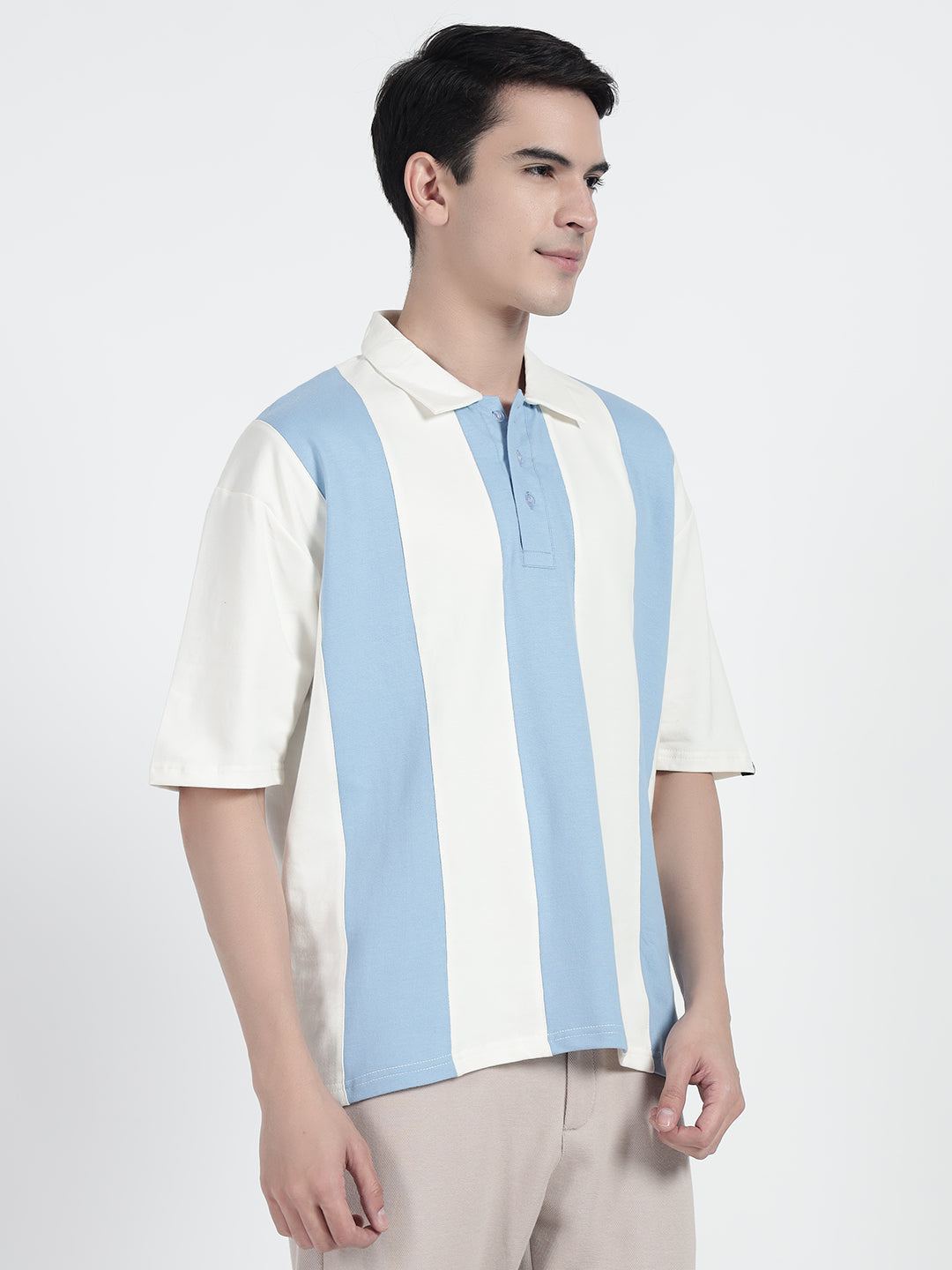 wearing a striped oversized polo shirt in white by cartoonpanti india