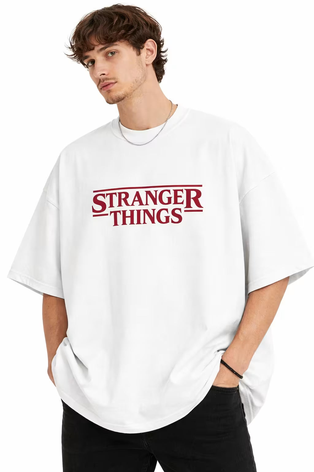 Person wearing a white 'Stranger Things' oversized t-shirt on a white background