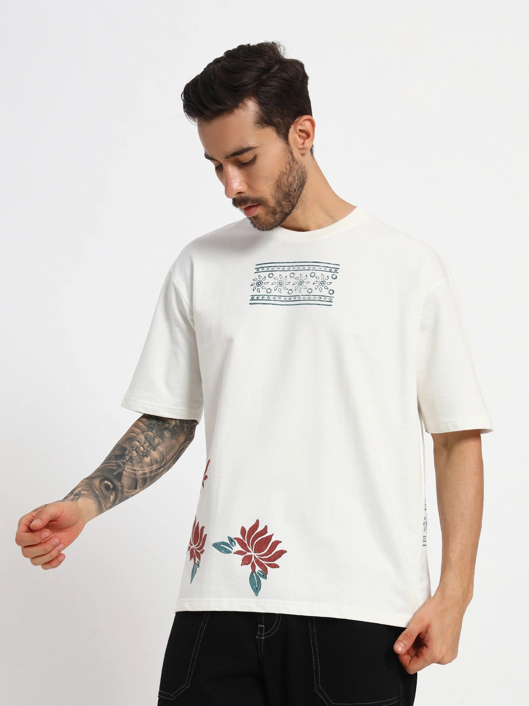 Man wearing a white overzised t-shirt with floral designs  by cartoonpanti  india