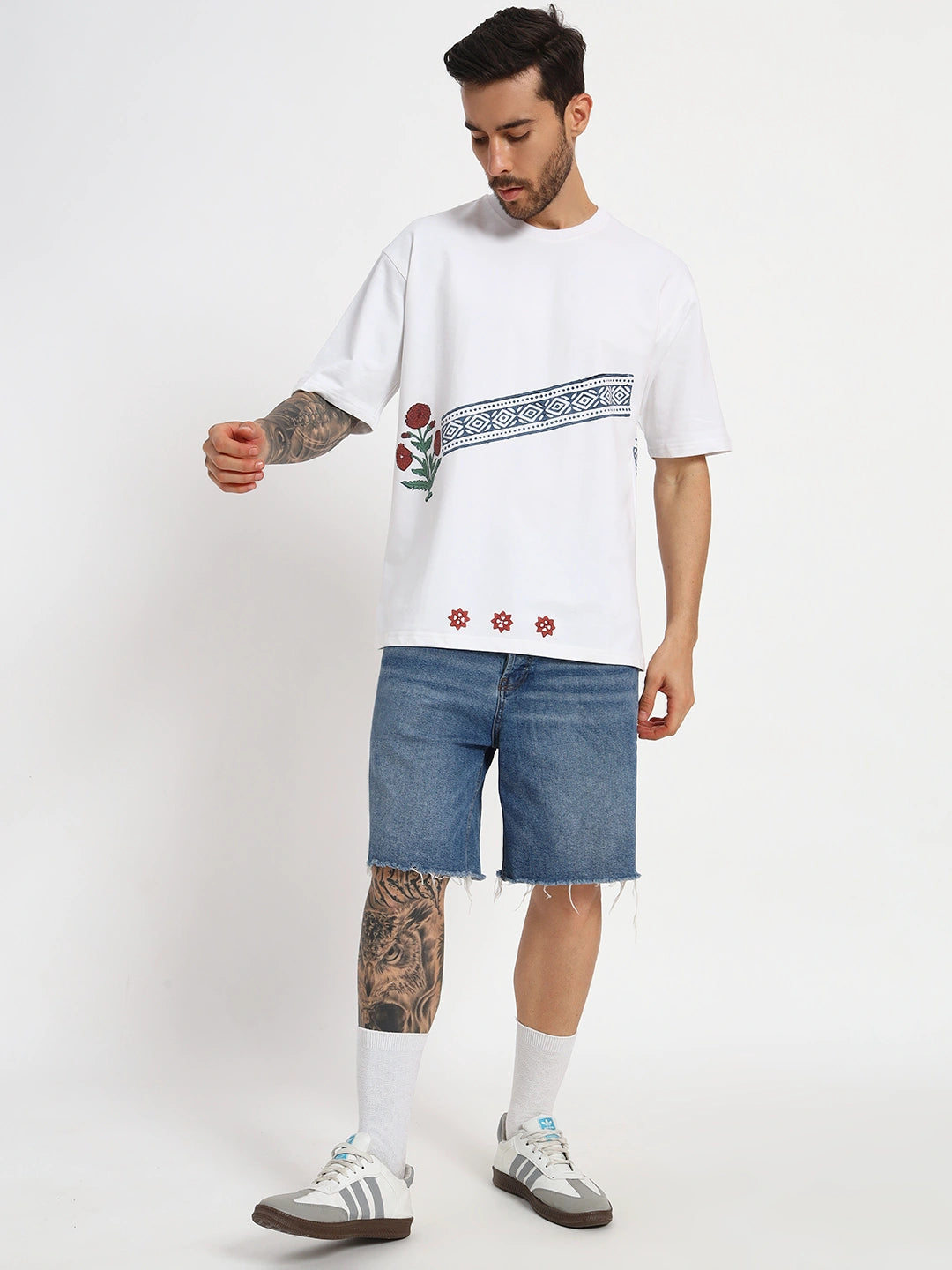 Man wearing a white oversized t-shirt with floral designs  cartoonpanti by india