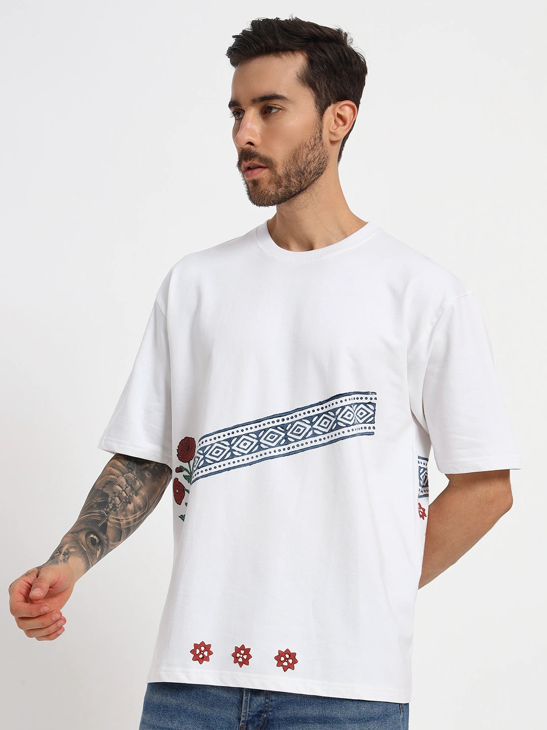 Man wearing a white t-shirt with a pattern on a plain  by cartoonpanti india