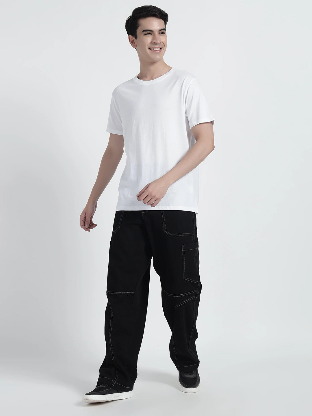 A person wearing a white plain T-shirt by cartoonpanti india.