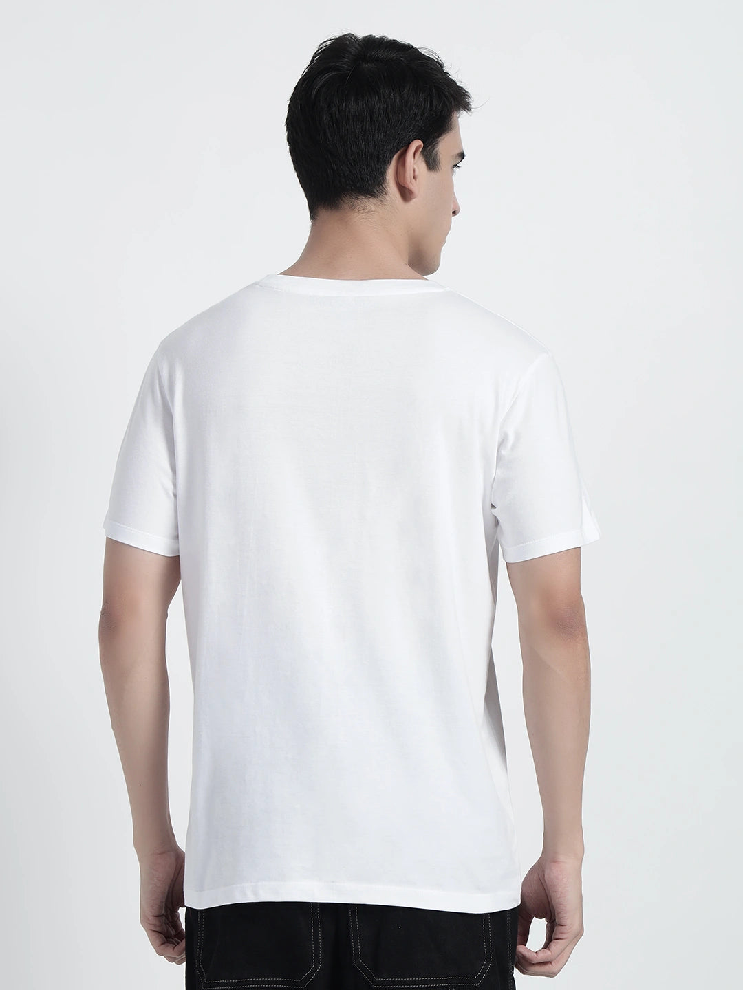 A person wearing a white plain T-shirt by cartoonpanti india.