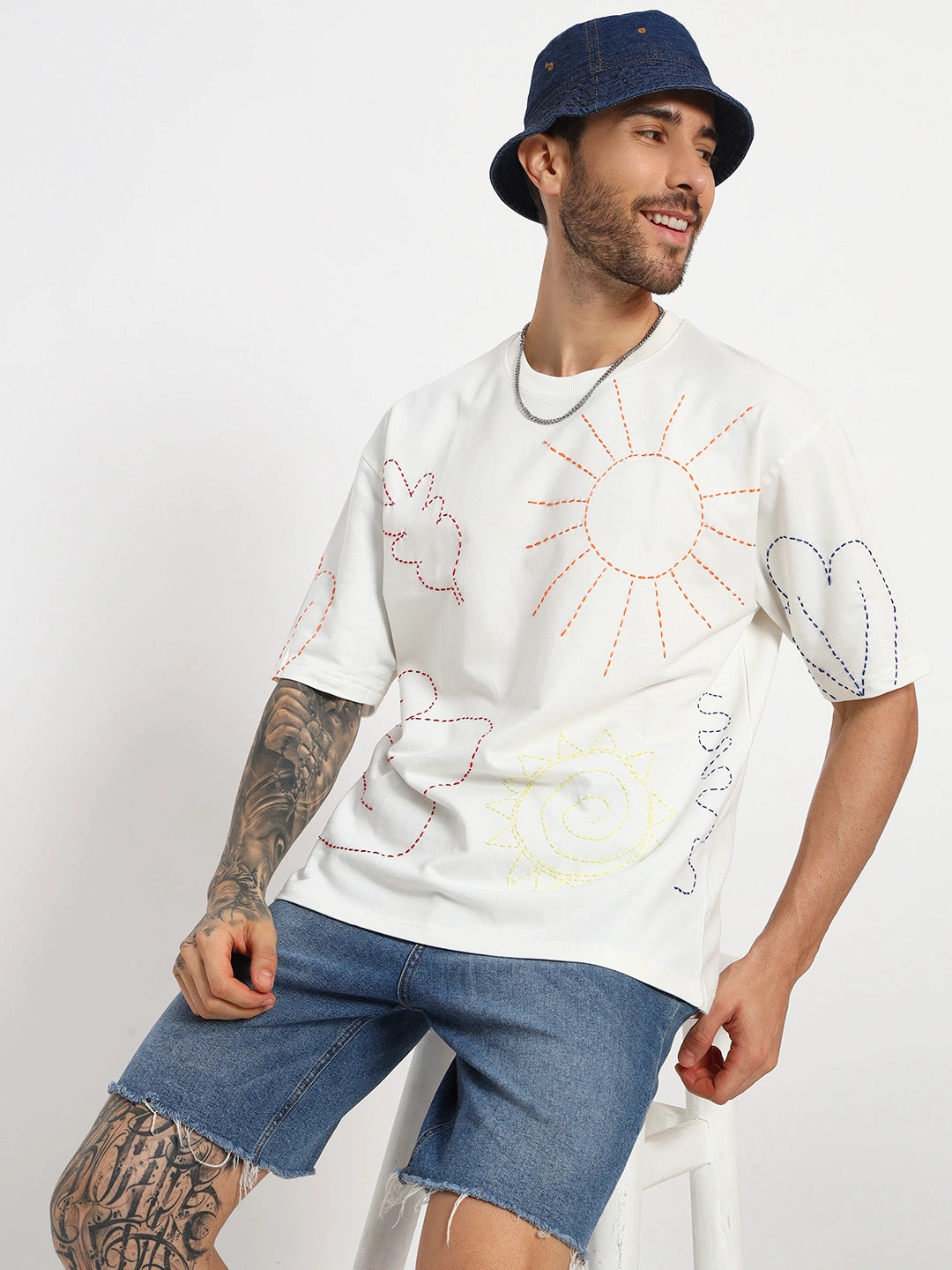 Man wearing a white t-shirt with graphics by cartoonpanti  india