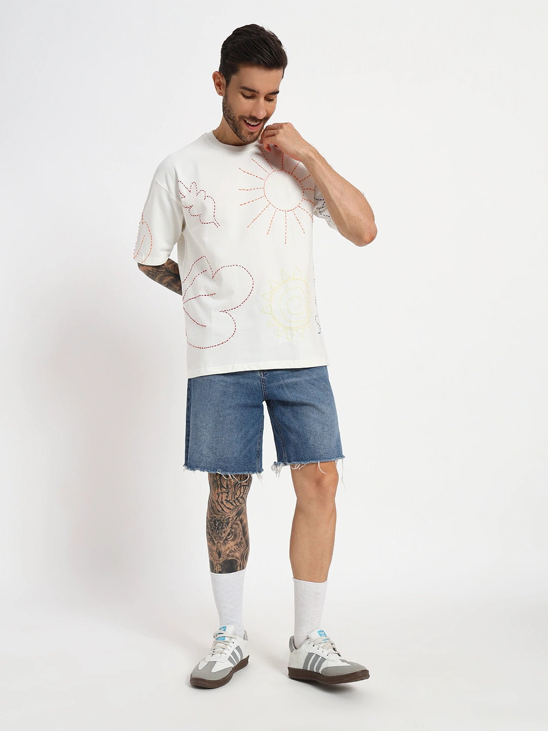 Man wearing a white t-shirt with abstract designs  by cartoonpanti india