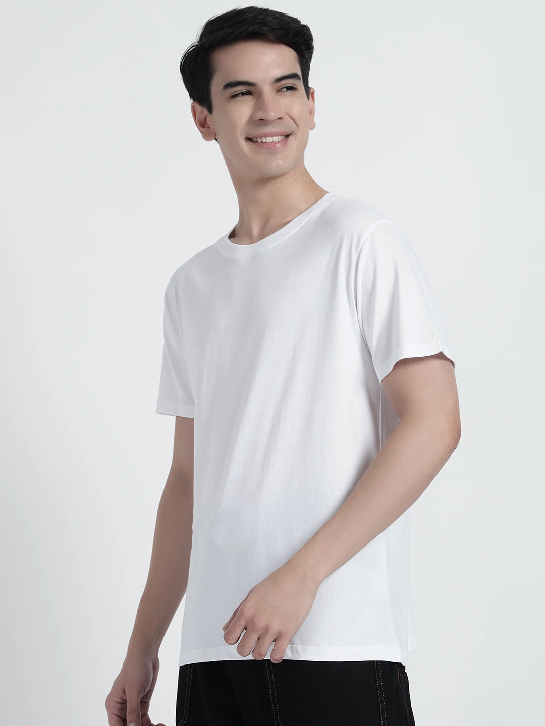 A person wearing a white plain T-shirt by cartoonpanti india.