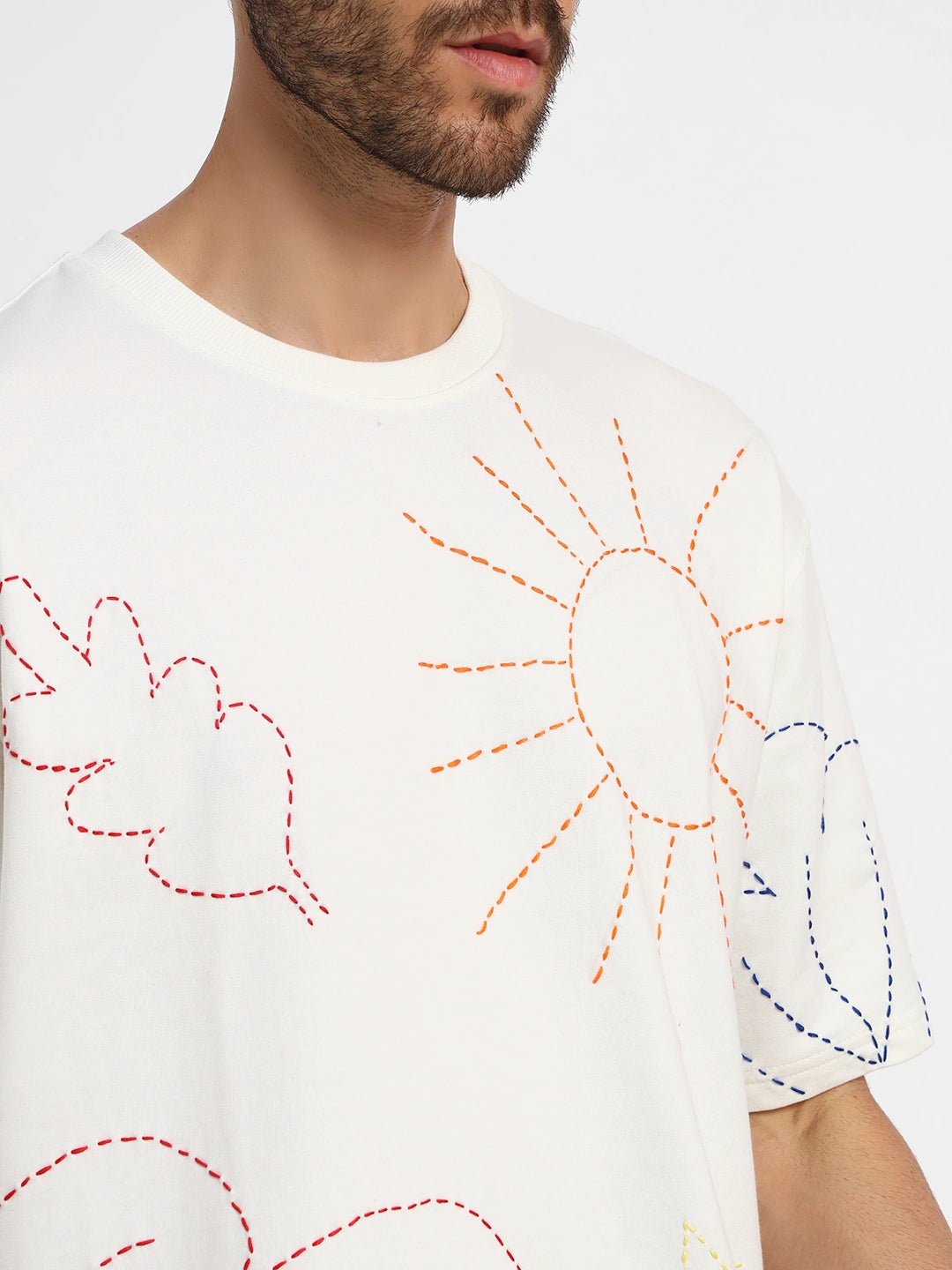 White oversized  t-shirt with colorful embroidered designs  by cartoonpanti  india